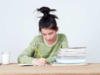Students do their homework at table.