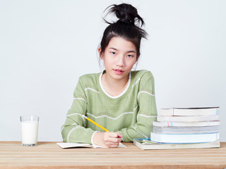 Students do their homework at table.