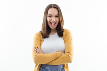 Portrait of a girl in a white t-shirt, yellow jacket and blue skirt on a white background