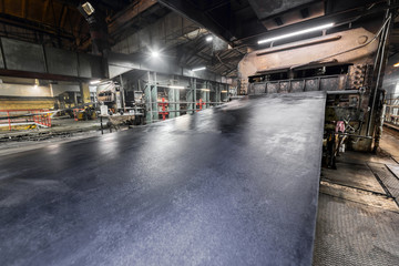 Large press for vulcanizing rubber bands.