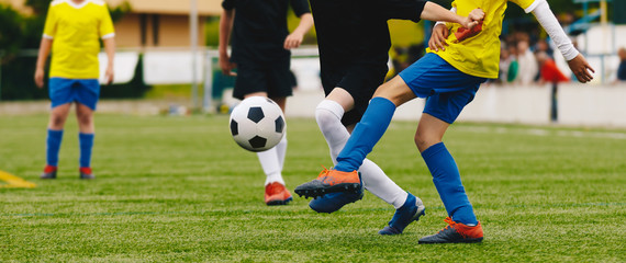 Junior Football Match. Boys Kicking Soccer Match on Grass Sports Field. Soccer Duel Between Youth...