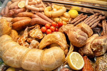 A variety of smoked, cured sausages, sausages, smoked meat