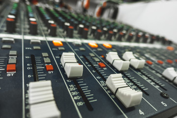 Close-up of professional concert mixing console, equipment for sound mixer control