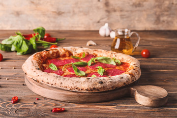 Tasty pizza on wooden table