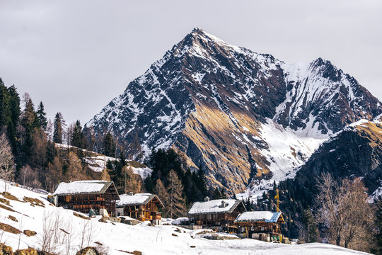 The traditional architecture of the Walser villages in the valleys of Monte Rosa, during a fantastic winter day, near the town of Alagna, Italy - February 2020.