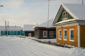 wooden village houses in the North in winter