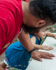 Bangi, Malaysia - February 17, 2019: Father workout with toddler at the park.