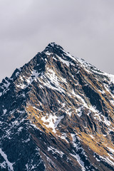The snowy mountains of Valsesia seen from the val d'otro, during a sunny day near the town of Alagna, Italy - February 2020.