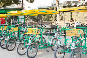 Fototapeta na wymiar four-wheel bicycles for rent