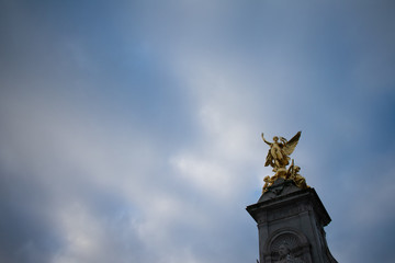 Golden Statue with Blue Sky Background