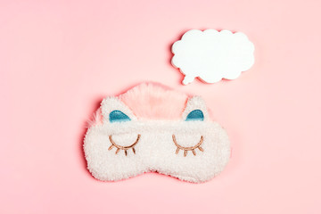 Funny sleeping mask with speech bubble on pink background. Copy space for text.