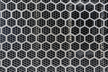 Metal background with hexagon holes perforation, net of circles texture