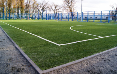 Artificial turf football field in park.