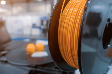 Orange plastic wire for 3D printer