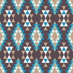 Geometric ornament of rhombuses and triangles in the native American style. Seamless vector pattern for web, print, textile, wallpaper, card, wrapping paper and background