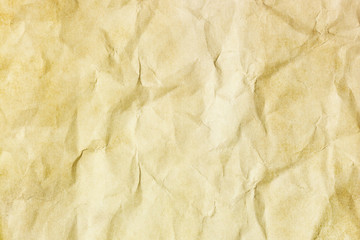 Brown crumpled paper texture. Grunge old parchment background. Stained dirty burned message backdrop for graphic design. Vintage ancient empty copy space background.