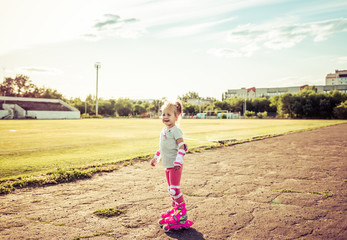 Child learns to roller skate. Roller skating