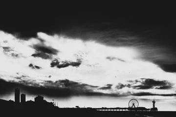 Deurstickers Dramatic black and white shot of the pier in Scheveningen the netherlands. © Hugo
