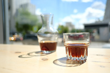 Stylish served specialty alternative black coffee. Filter pour-over coffee served in crystal glass and decanter. Aesthetics coffee