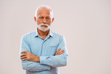 Portrait of pensive and serious senior man.