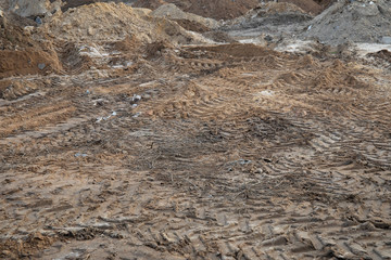 Large tire prints in industrial soil of construction site