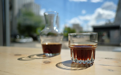 Stylish served specialty alternative black coffee. Filter pour-over coffee served in crystal glass and decanter. Aesthetics coffee