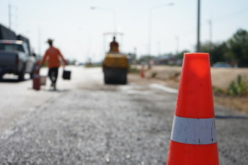 Red rubber cone in road construction And background blur