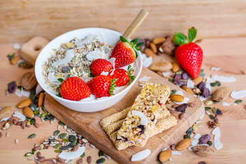 Healthy Breakfast with Muesli with Strawberries and Granola Bars