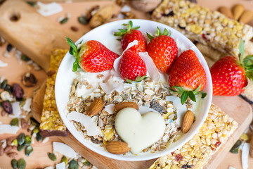 Healthy Breakfast with Muesli with Strawberries and Granola Bars