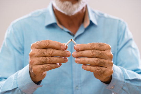 Serious Senior Man Is Decided To Quit Smoking.