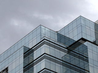 modern office building and blue sky reflection in glass windows