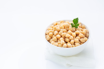 Chickpeas on  plate, isolated on  white background.
