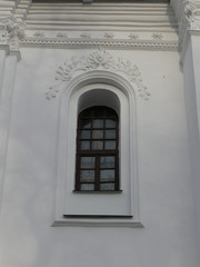 Old wooden round window in retro building from the ancient times