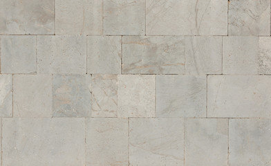 Old white marble block wall as background