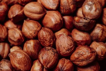 Purified hazelnuts on market counter in daylight. Fresh nuts in macro photo. Close up. Top view.