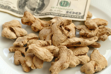 100 usd banknote and dry ginger 