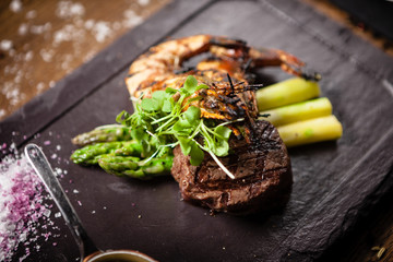 Tasting menu. Beef steak and grilled tiger prawns.