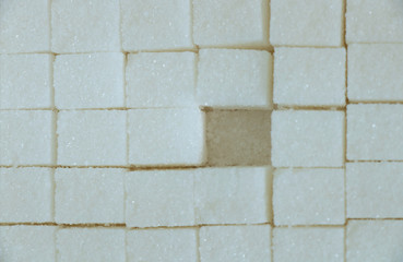 a lot of cubes of refined white sugar in a package close-up