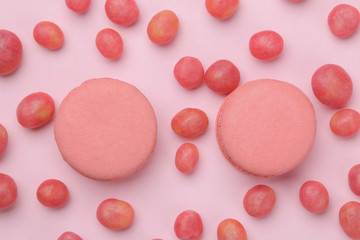 The concept of minimalism. pasta cake and delicious bright pink sweets on a bright pink background. top view