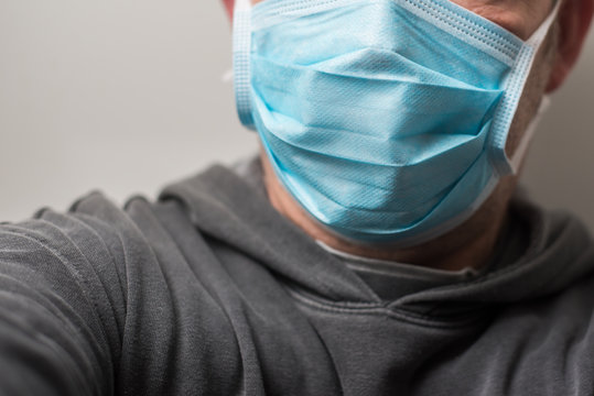 Closeup of man with medical mask to protect against the corona virus