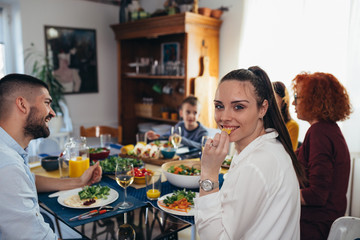 family gathering at home. vegan dinner party
