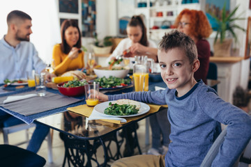 family gathering at home. vegan dinner party