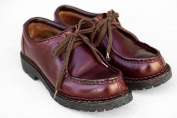 We maintained burgundy leather boots.