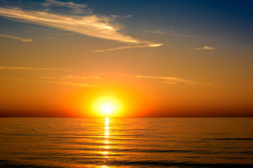 Fototapeta na wymiar beautifun sunset on the beach with calm sea