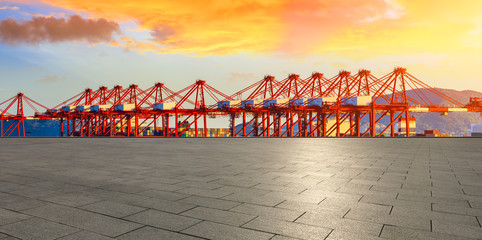 Empty floor and industrial container freight port at beautiful sunset in Shanghai.