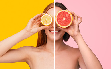 Young women covering eyes with citrus fruits