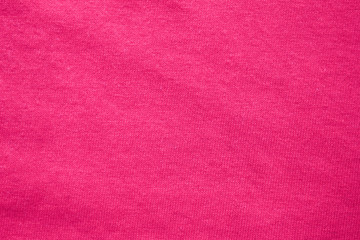 Fototapeta premium Pink fabric texture background, soft cotton cloth backdrop. Blank pink fabric pattern, smooth seamless cloth wallpaper, plain colorful shirt element