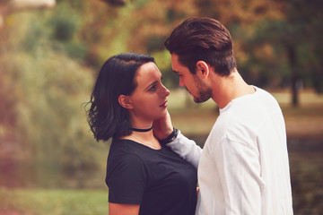 Fototapeta premium Couple in love hugging and kissing outdoors. Love concept.