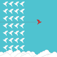 Think differently concept. Be different. Red bird changing direction. New idea, change, trend, courage, creative solution, innovation and unique way concept.	