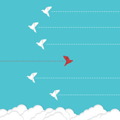 Think differently concept. Be different. Red bird changing direction. New idea, change, trend, courage, creative solution, innovation and unique way concept.	